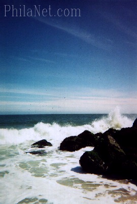 A Wave Breaks on the Rocks in
Cape May, NJ